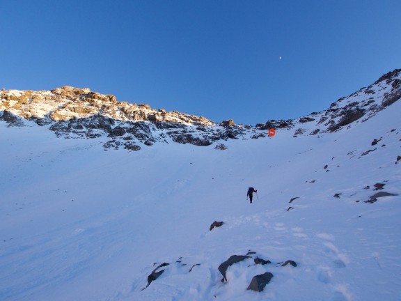 Heading up towards the saddle. The red circle is where they triggered the avalanche.
