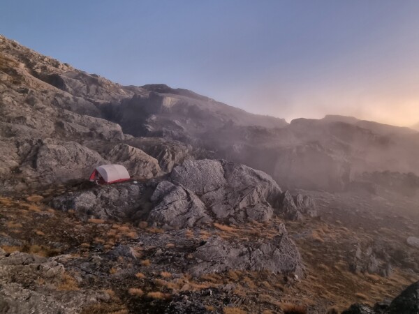 Nice campsite sheltered from the wind and elevated from rainwater paths