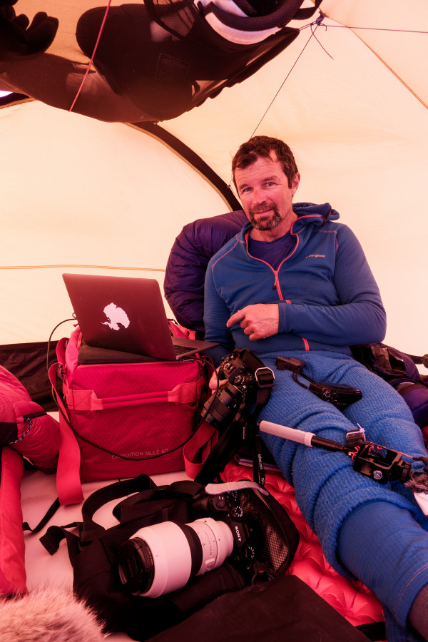 Mark Sedon backing up the day’s photos in their tent. PHOTO/MARK SEDON