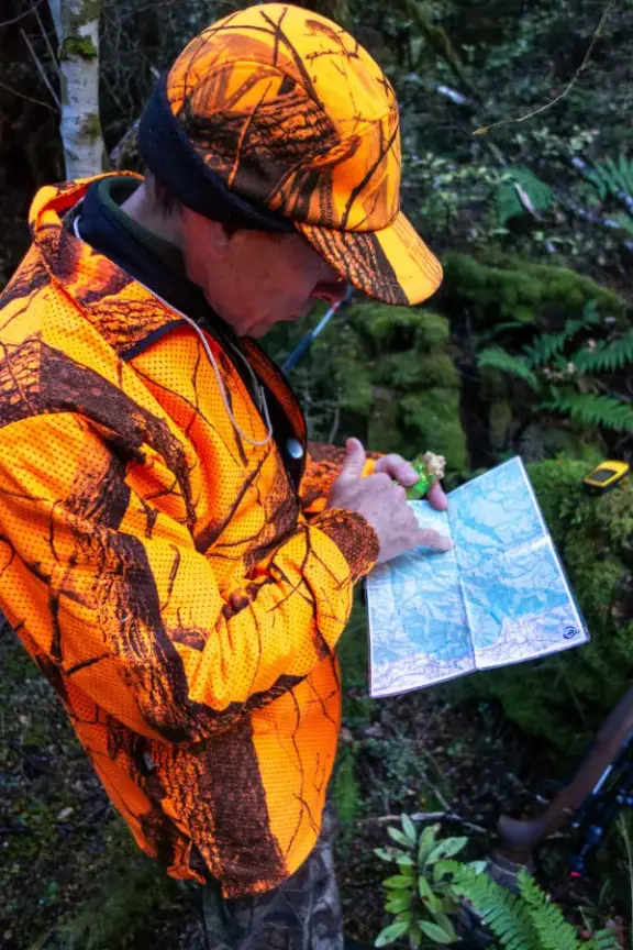Hunter planning route on map
