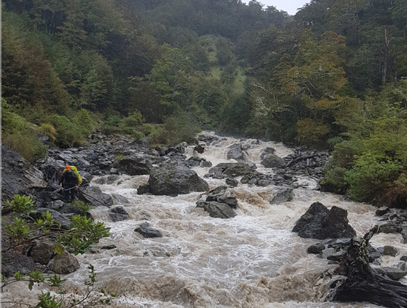 The flooded creek in Lewis making an easy walk extremely difficult