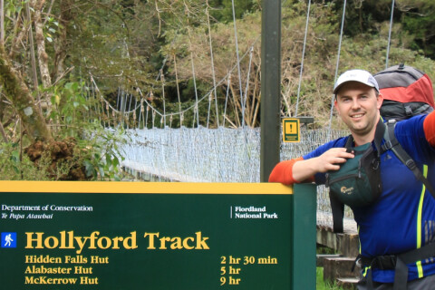 Thumbnail of Hollyford Track sign with Nathan Watson