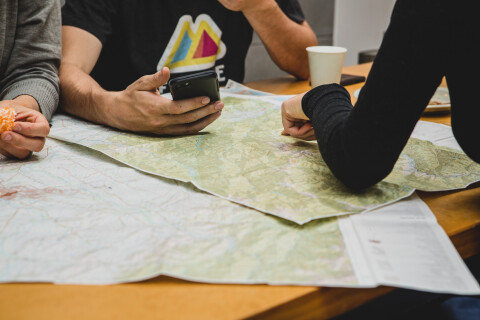 Thumbnail of People planning with Plan My Walk at home hold phone | Caleb Smith
