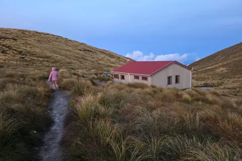 children walking along path towards Kime Hut 