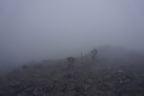 Trampers in poor visibility Taranaki Maunga